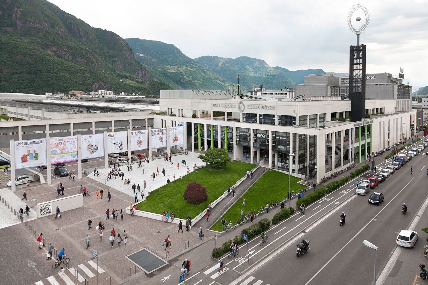 Messe Bozen panorama View of Messe Bozen with its forecourt, street, and surrounding mountain landscape.