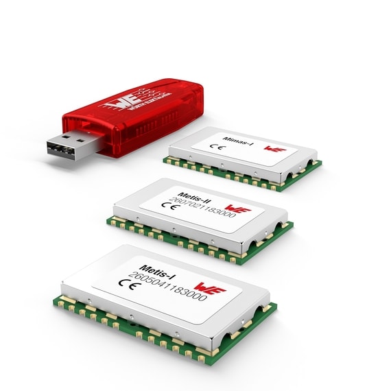 Three electronic components and one red USB stick on white background
