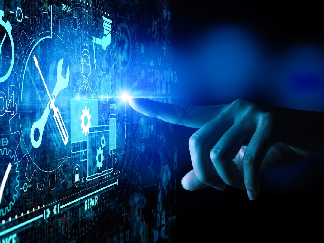 finger pointing at high tech computer screen