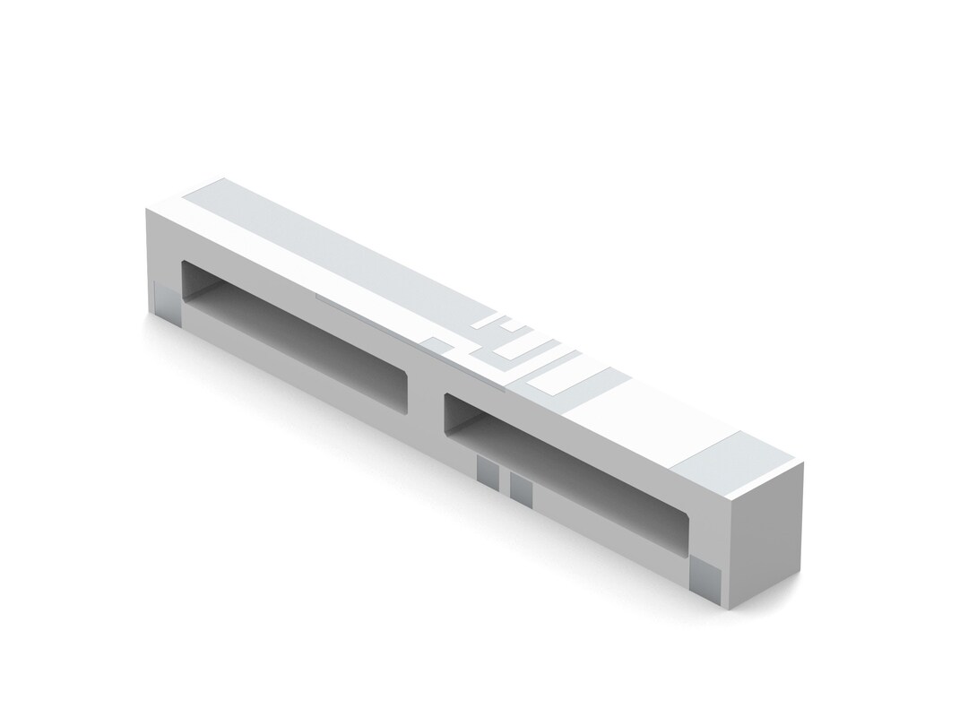 long skinny white and gray component with two rectangular holes in the side