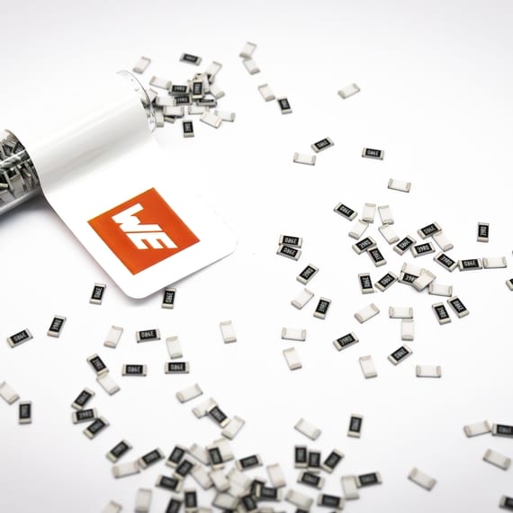 The small black thick film resistors on a white background