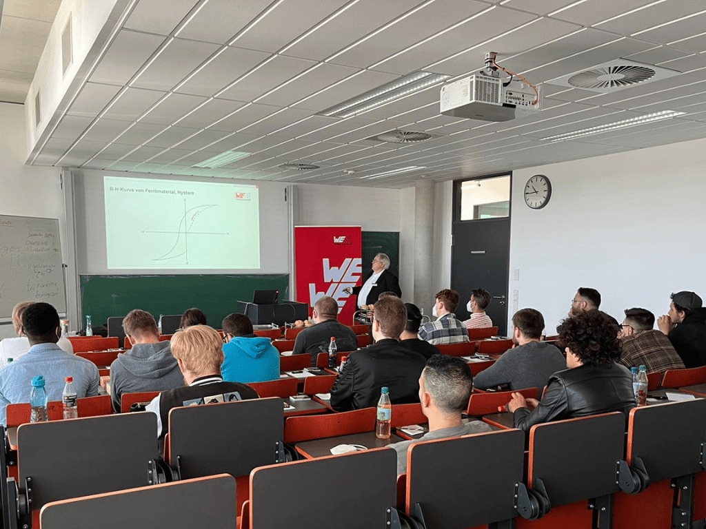 Würth Elektronik presenting to a classroom with young adults sitting in desks