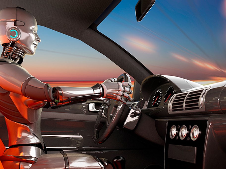Ein Crash Test Dummy am Lenkrad eines Fahrzeugs