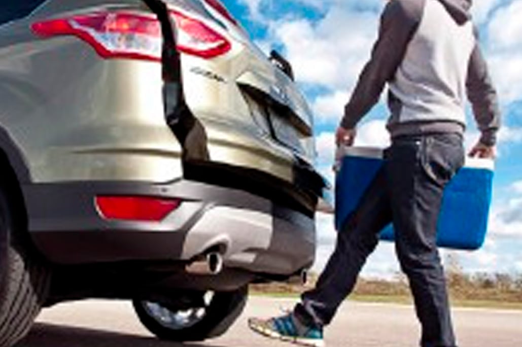 Automotive Applications Comfort A person is opening the hatch of his car via a foot sensor