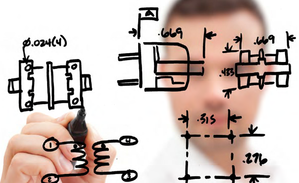 Custom Solution Schematic A man is drawing a circuit diagram.
