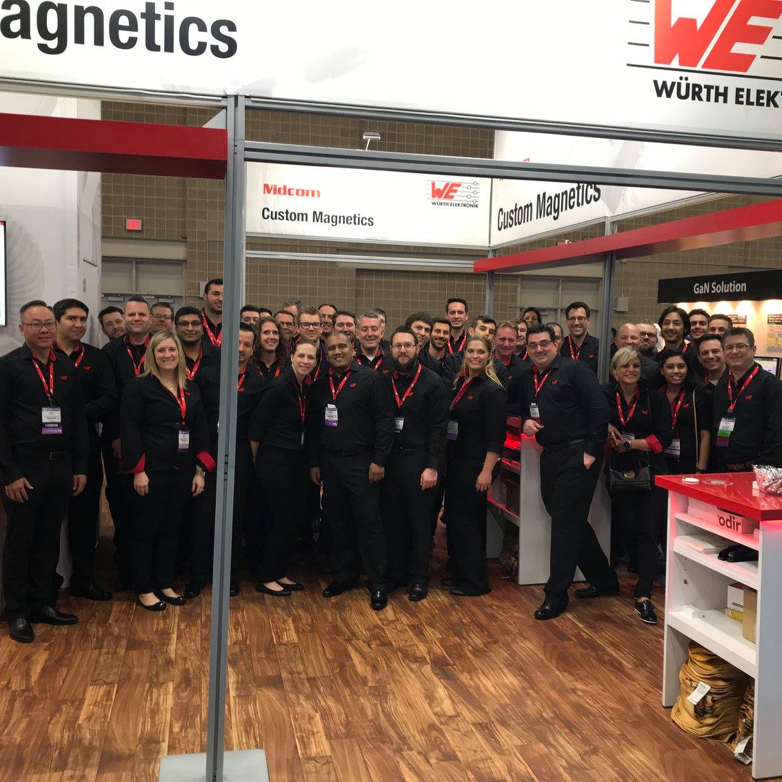 APEC Team standing in front of booth at the APEC convention - 2018 APEC Team standing in front of booth at the APEC convention - 2018