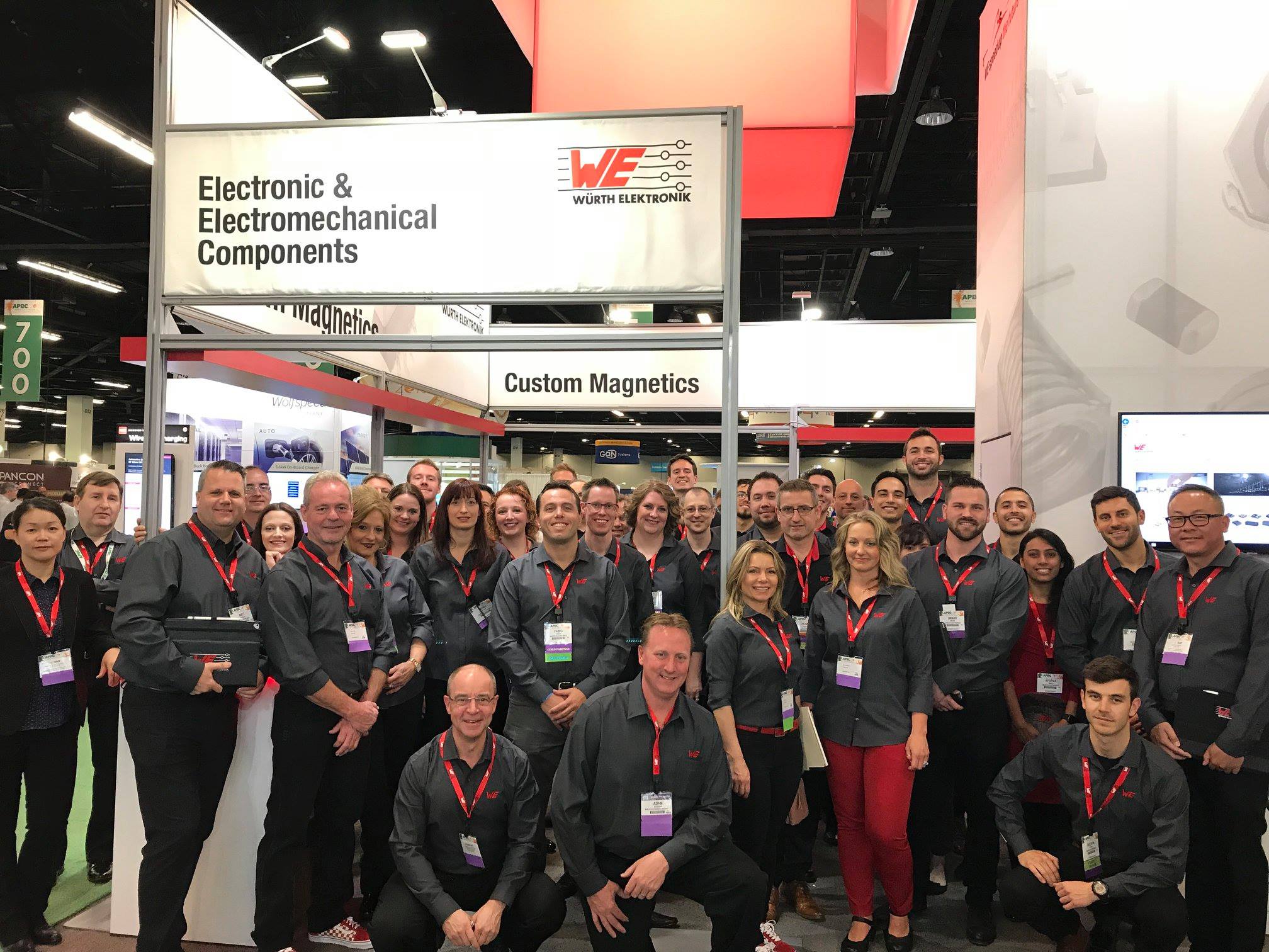 APEC Team standing in front of booth at the APEC convention - 2019 APEC Team standing in front of booth at the APEC convention - 2019