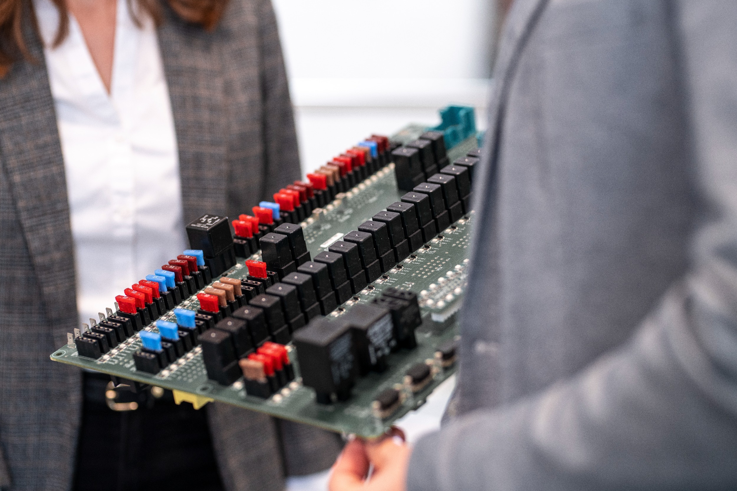 Employee with central electrical unit in hand Employee with central electrical unit in hand