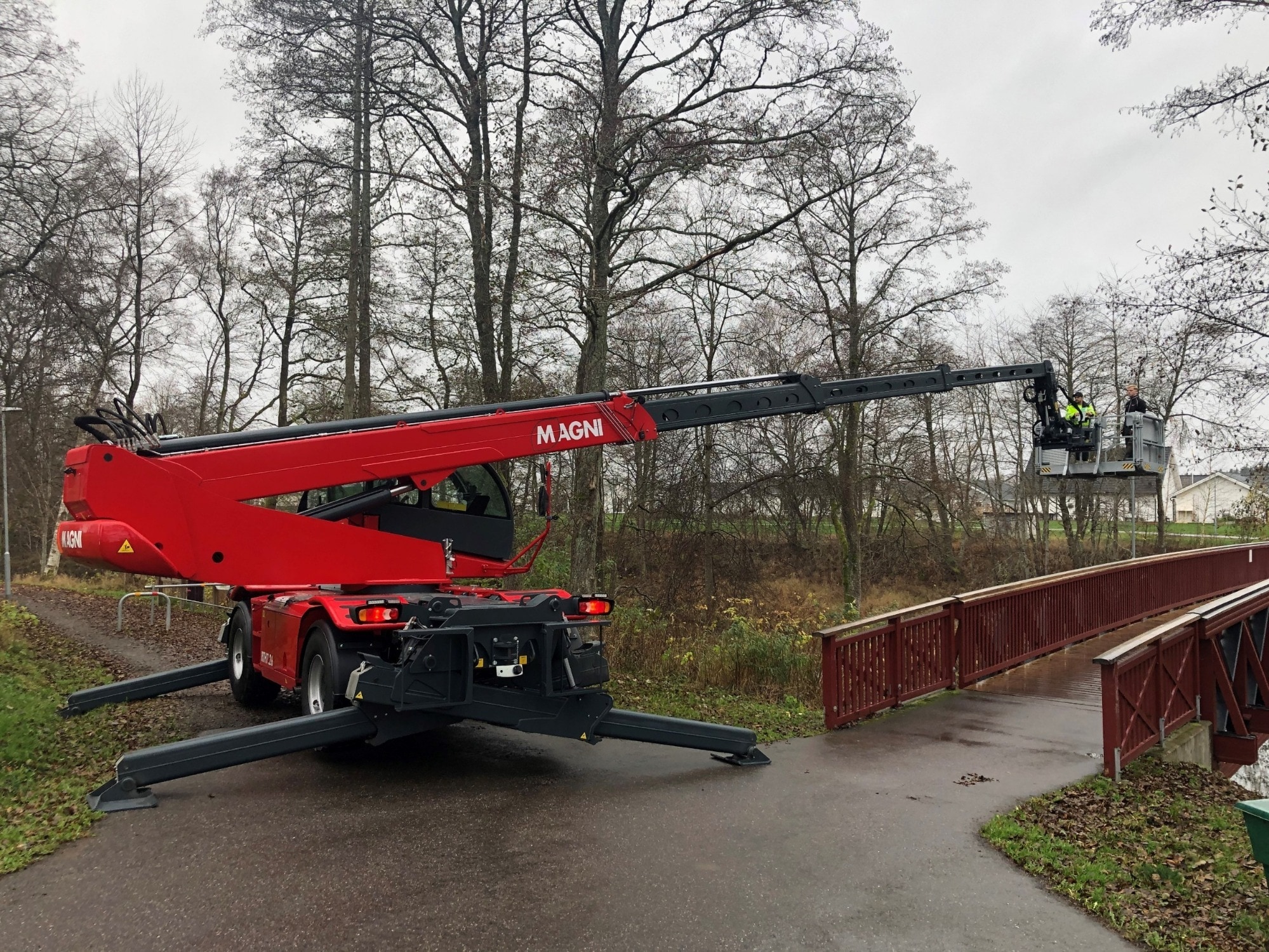 Reference picture Magni Red telescopic handler of the manufacturer Magni in the woo with build up lifting basket